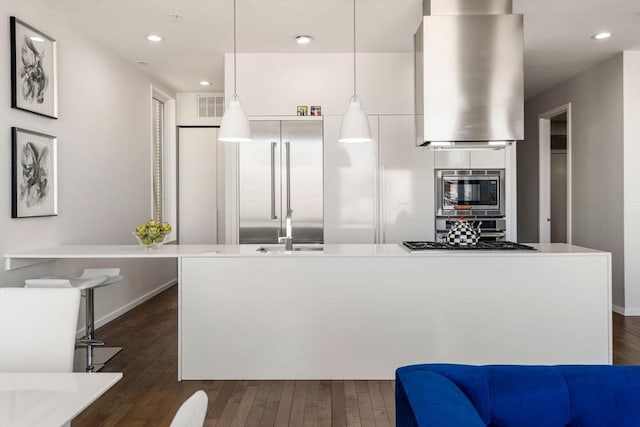 525 E 1st St Unit 5, Boston, MA 02127 - kitchen with dark wood-type flooring, built in appliances, island exhaust hood, and recessed lighting