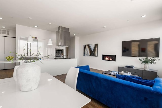 525 E 1st St Unit 5, Boston, MA 02127 - living room featuring dark wood-style floors, a glass covered fireplace, and recessed lighting