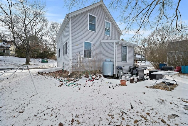 view of snow covered house