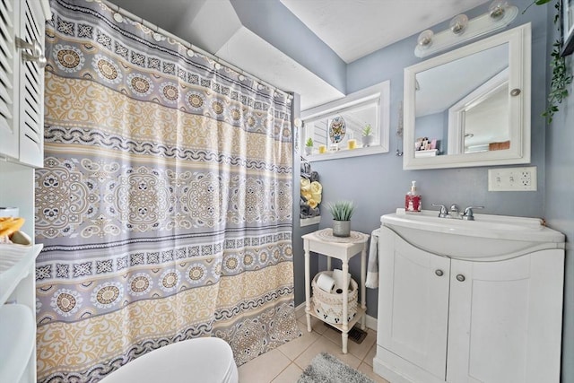 bathroom featuring tile patterned flooring, vanity, a shower with curtain, and toilet