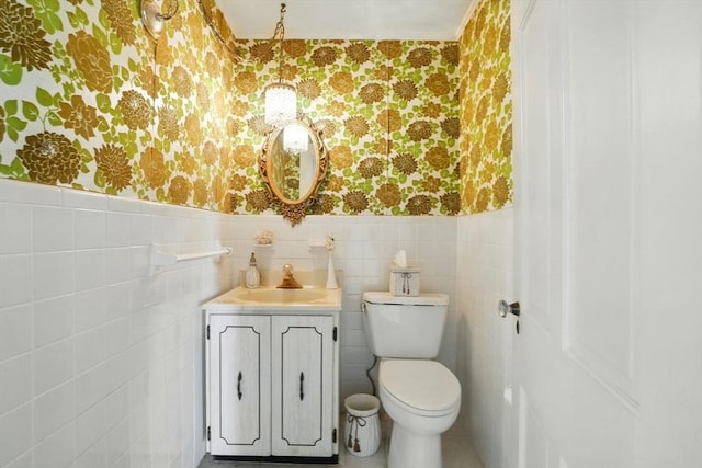 157 Washington St, Duxbury, MA 02332 - bathroom with toilet, wallpapered walls, vanity, and a wainscoted wall