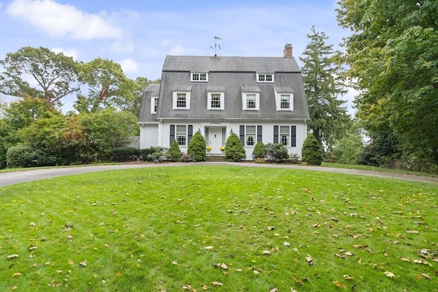 157 Washington St, Duxbury, MA 02332 - dutch colonial featuring a chimney and a front lawn