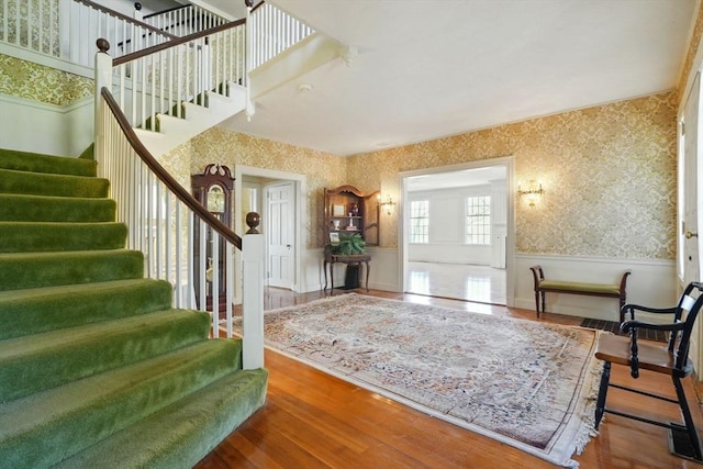 157 Washington St, Duxbury, MA 02332 - entrance foyer with a wainscoted wall, stairway, and wallpapered walls