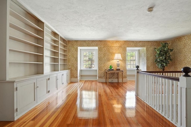 157 Washington St, Duxbury, MA 02332 - unfurnished room with wallpapered walls, a wealth of natural light, and a textured ceiling