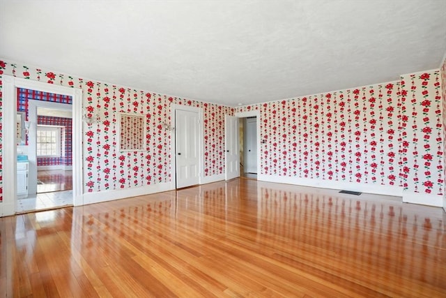 157 Washington St, Duxbury, MA 02332 - unfurnished room with baseboards, hardwood / wood-style flooring, and wallpapered walls
