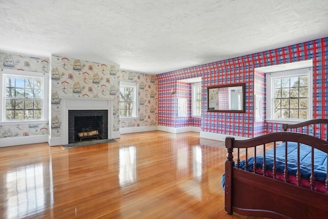 157 Washington St, Duxbury, MA 02332 - bedroom with multiple windows, a textured ceiling, and wallpapered walls