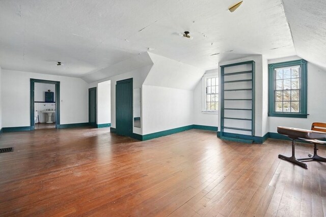 157 Washington St, Duxbury, MA 02332 - additional living space featuring hardwood / wood-style floors, lofted ceiling, and a wealth of natural light