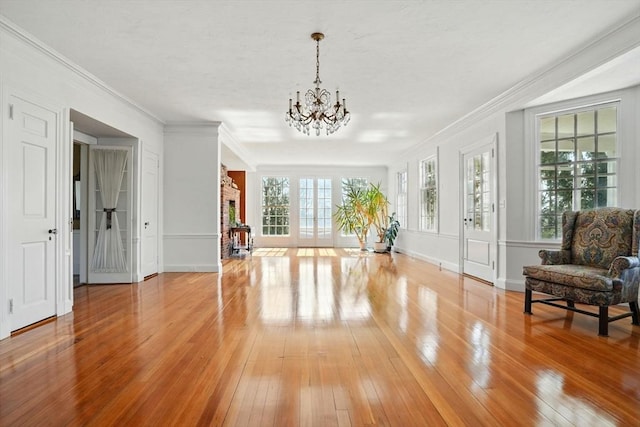 157 Washington St, Duxbury, MA 02332 - unfurnished room with a chandelier, light wood-type flooring, and ornamental molding