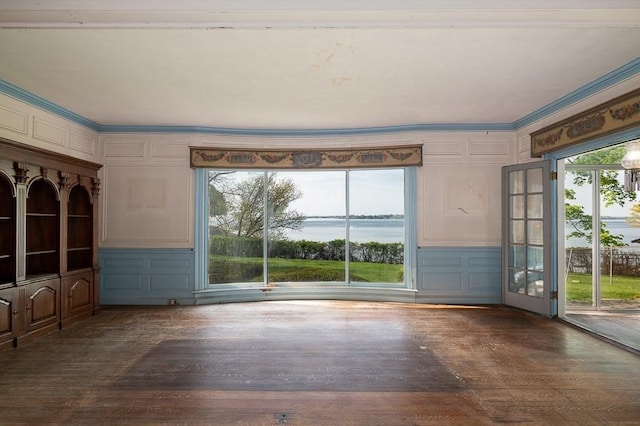 40 Prince St, Beverly, MA 01915 - unfurnished living room with a decorative wall, wood finished floors, and crown molding