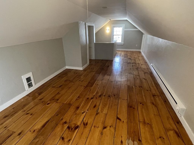 bonus room with hardwood / wood-style flooring, a baseboard radiator, and lofted ceiling