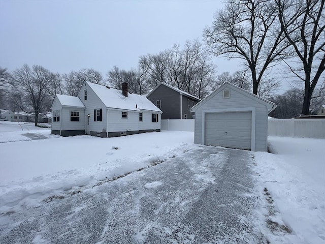 exterior space with a garage and an outdoor structure