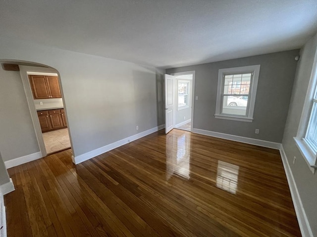 spare room featuring dark hardwood / wood-style flooring