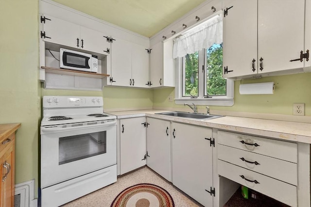 18 Stover Ct, Amesbury, MA 01913 - kitchen with white appliances, white cabinets, and light countertops