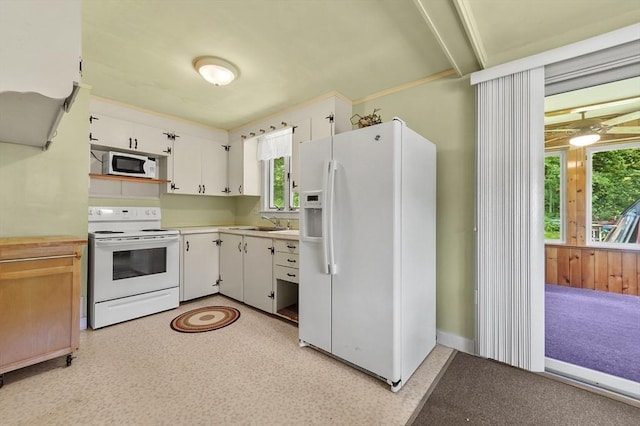 18 Stover Ct, Amesbury, MA 01913 - kitchen with white appliances, light countertops, and white cabinetry