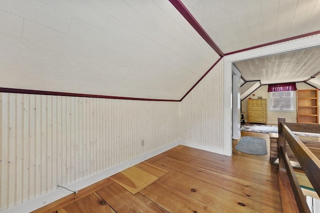 18 Stover Ct, Amesbury, MA 01913 - stairway with hardwood / wood-style flooring, lofted ceiling, and wood walls