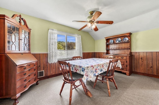 18 Stover Ct, Amesbury, MA 01913 - dining space with wainscoting, wood walls, ceiling fan, and light colored carpet