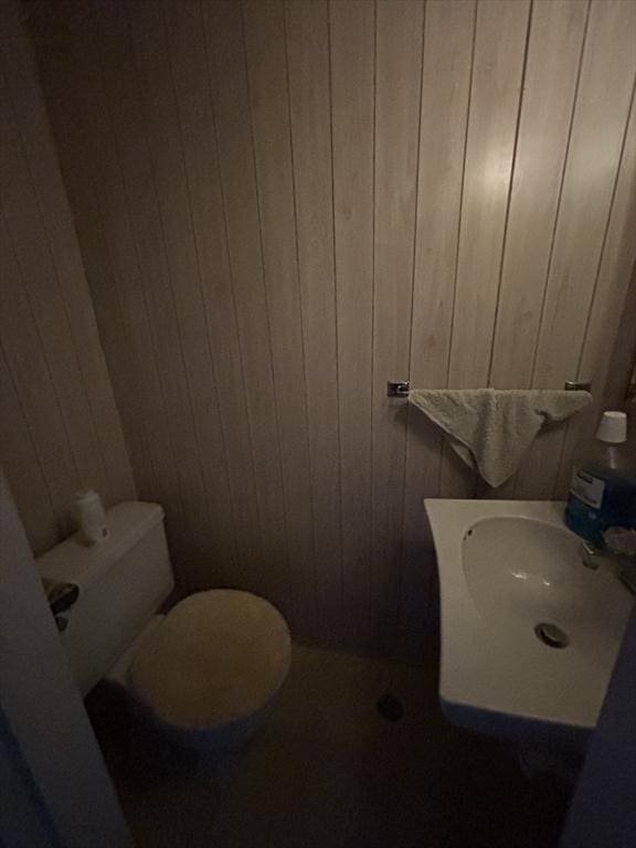 113 Lexington St, Springfield, MA 01107 - half bathroom with toilet and wood walls