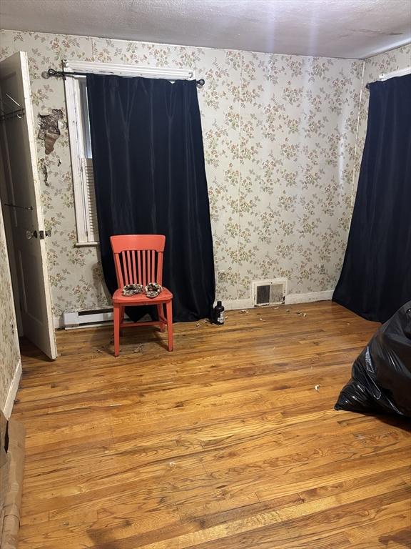 113 Lexington St, Springfield, MA 01107 - unfurnished room with hardwood / wood-style flooring and wallpapered walls