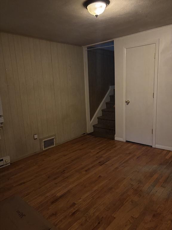 113 Lexington St, Springfield, MA 01107 - finished basement with wood finished floors, stairs, and wooden walls