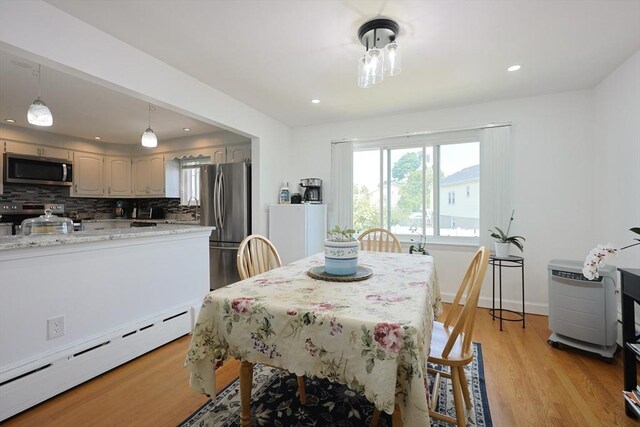 40 Atwood St, Revere, MA 02151 - dining area featuring baseboard heating, light wood-style flooring, and recessed lighting