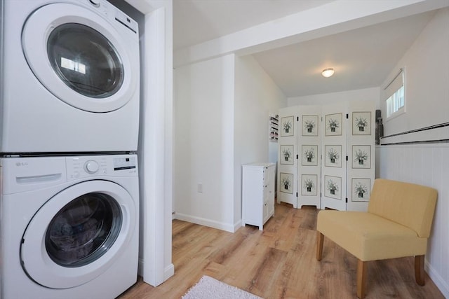 40 Atwood St, Revere, MA 02151 - laundry room with stacked washing machine and dryer and light wood-type flooring
