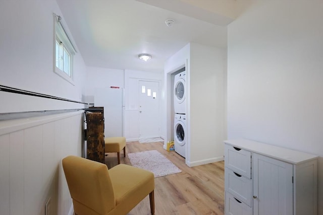 40 Atwood St, Revere, MA 02151 - laundry area with stacked washing machine and dryer and light wood finished floors