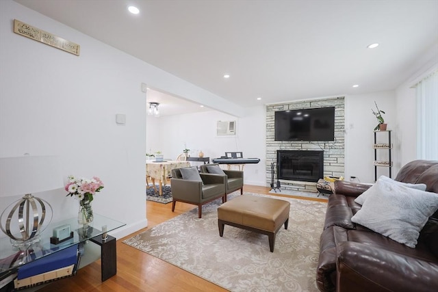 40 Atwood St, Revere, MA 02151 - living room featuring wood finished floors, recessed lighting, and a stone fireplace