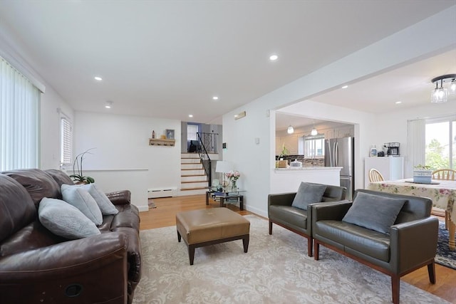 40 Atwood St, Revere, MA 02151 - living room with stairway, a baseboard heating unit, light wood-style floors, and recessed lighting