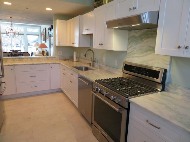 kitchen featuring a chandelier, stainless steel appliances, white cabinets, decorative light fixtures, and sink