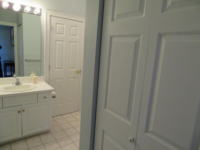 bathroom featuring tile patterned flooring and vanity