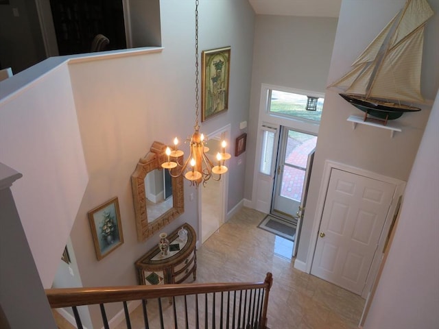 entrance foyer featuring a high ceiling and an inviting chandelier