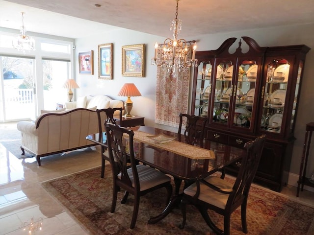 dining room with a notable chandelier