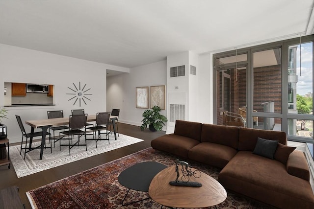 1 Charles St S Unit 604, Boston, MA 02116 - living area with dark wood finished floors and baseboards