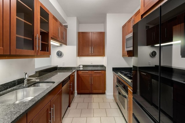 1 Charles St S Unit 604, Boston, MA 02116 - kitchen with appliances with stainless steel finishes, a sink, dark stone counters, and glass insert cabinets
