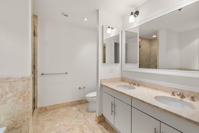 1 Charles St S Unit 604, Boston, MA 02116 - full bath featuring double vanity, toilet, tiled shower, and baseboards