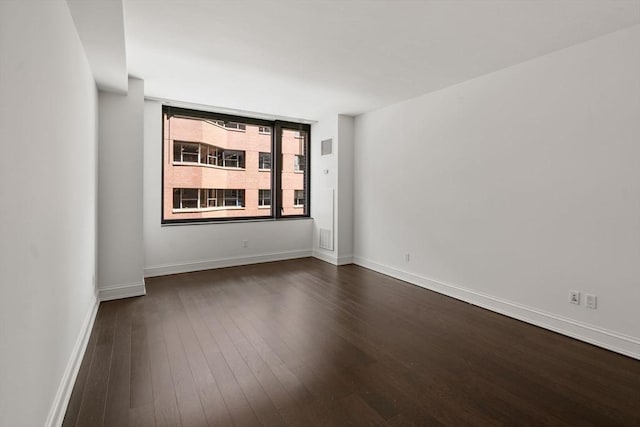 1 Charles St S Unit 604, Boston, MA 02116 - spare room featuring dark wood-style flooring and baseboards