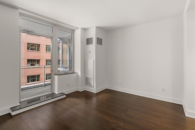 1 Charles St S Unit 604, Boston, MA 02116 - unfurnished room with dark wood-type flooring and baseboards