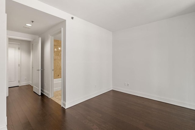 1 Charles St S Unit 604, Boston, MA 02116 - empty room with dark wood-type flooring and baseboards