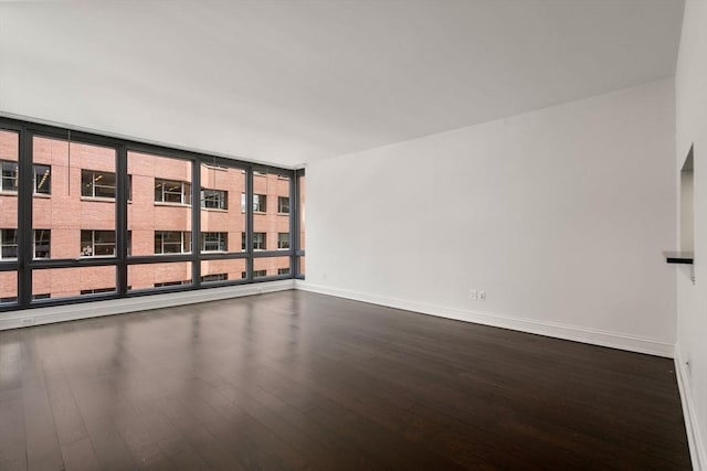 1 Charles St S Unit 604, Boston, MA 02116 - empty room featuring dark wood finished floors and baseboards