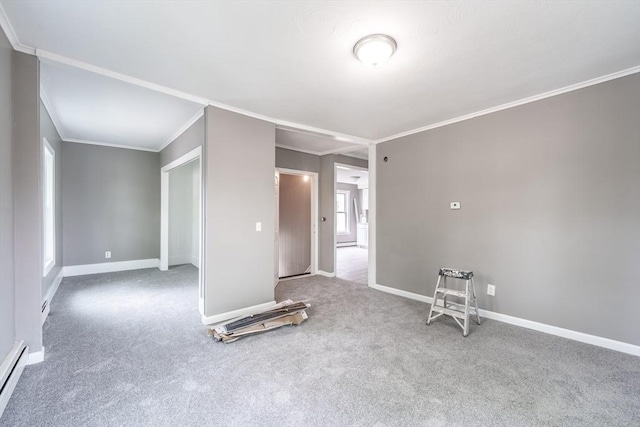 carpeted empty room featuring crown molding, a baseboard radiator, and baseboards
