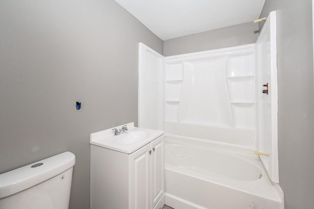 bathroom with toilet, shower / bathing tub combination, and vanity
