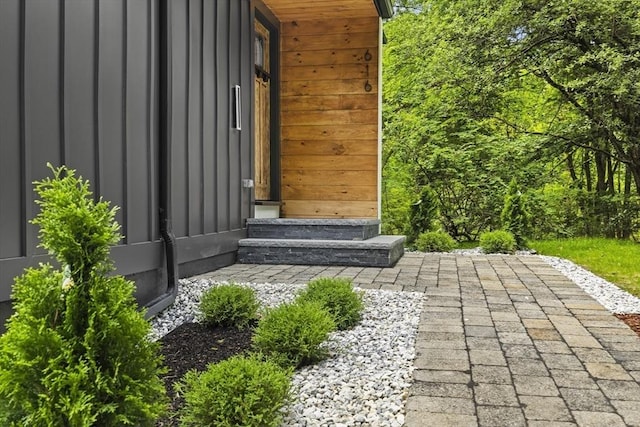 616 Grove St, Framingham, MA 01701 - doorway to property featuring board and batten siding