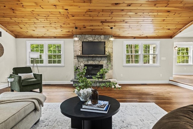 616 Grove St, Framingham, MA 01701 - living area with wood ceiling, a stone fireplace, wood finished floors, and lofted ceiling