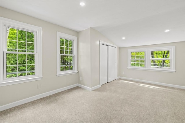 616 Grove St, Framingham, MA 01701 - unfurnished bedroom with lofted ceiling, carpet flooring, recessed lighting, and a closet