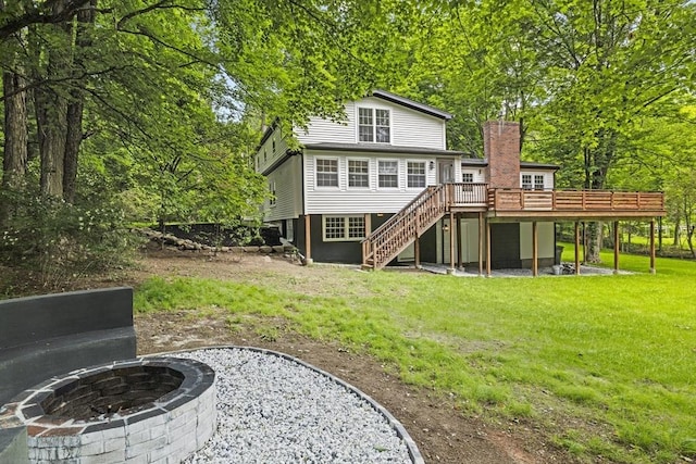 616 Grove St, Framingham, MA 01701 - rear view of property featuring a fire pit, stairs, a deck, a yard, and a chimney