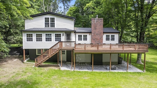 616 Grove St, Framingham, MA 01701 - back of property with a wooden deck, a chimney, stairs, and a patio
