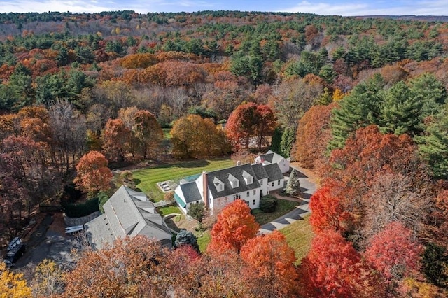 aerial view featuring a wooded view