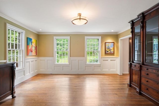 10 Queen Anne Rd, Hopkinton, MA 01748 - spare room featuring crown molding, wood finished floors, and wainscoting