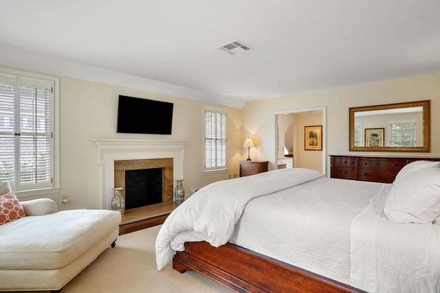 10 Queen Anne Rd, Hopkinton, MA 01748 - carpeted bedroom with visible vents and a fireplace with raised hearth