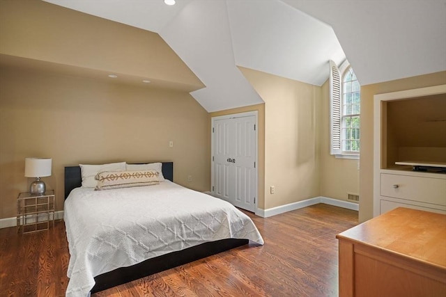10 Queen Anne Rd, Hopkinton, MA 01748 - bedroom with lofted ceiling, a closet, wood finished floors, and baseboards